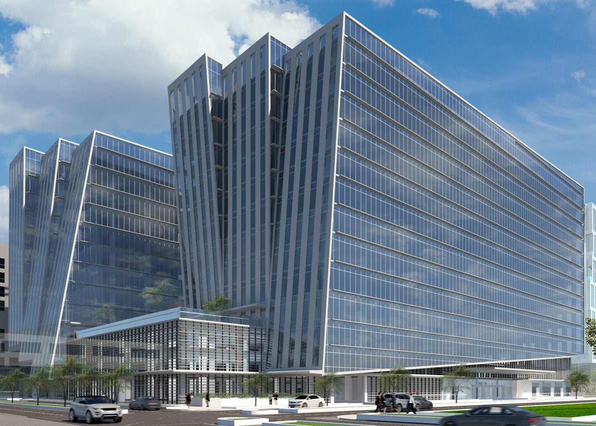 A modern glass office building complex with multiple angular towers under a blue sky with white clouds, shown as a digital architectural rendering with small cars and trees at the base.